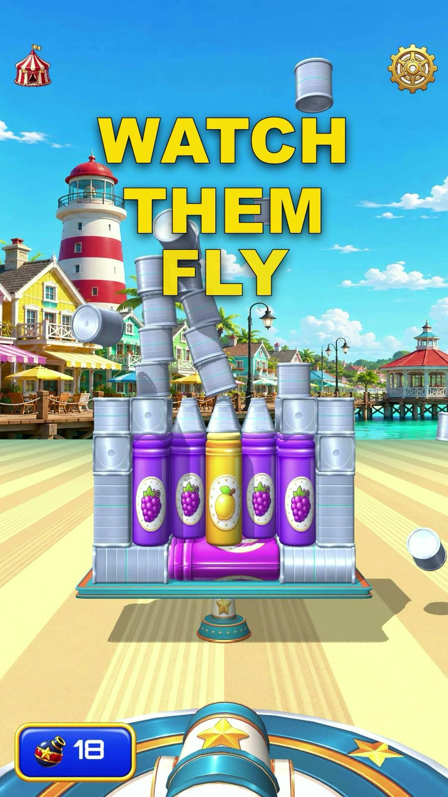 Cannon Carnival gameplay: a can tower on a seaside boardwalk, mid-collapse